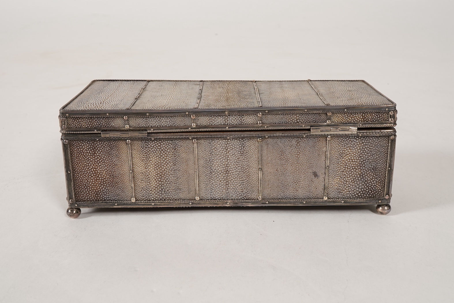 An early 20th century Arts & Crafts silver and shagreen mounted cigarette box with hinged cover, by John Paul Cooper